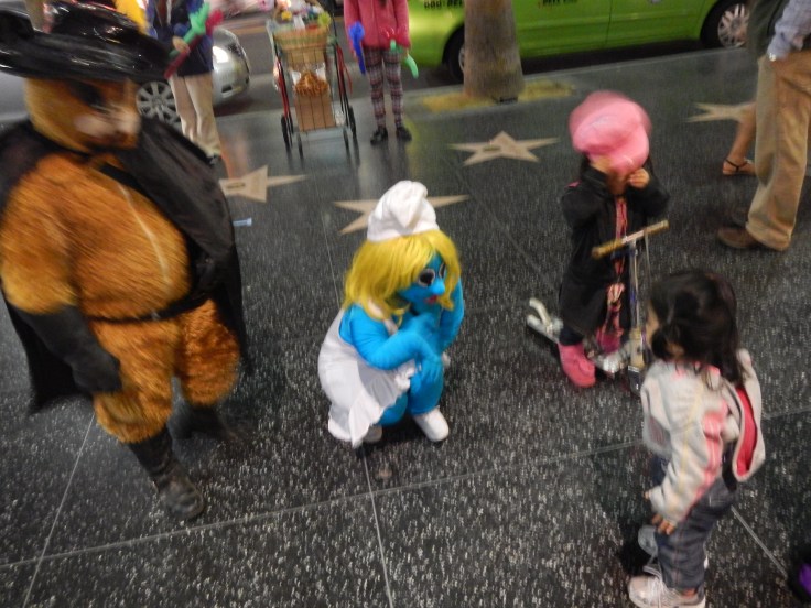 Munchkin meets the mini-stars at Hollywood Walk of Fame last month